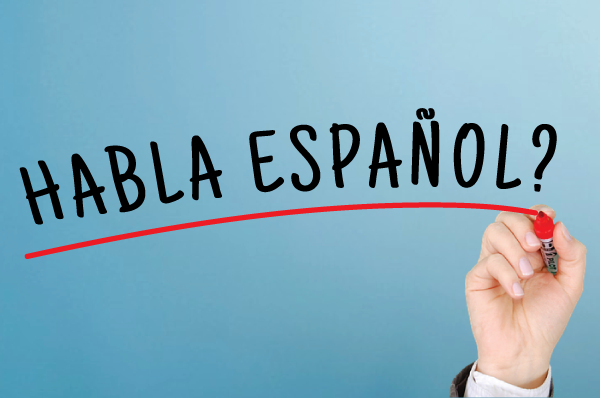 hand underlining text reading "habla espanol"