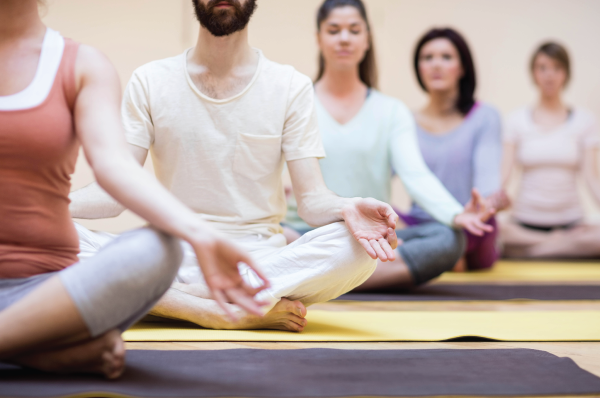 line of people seated meditating