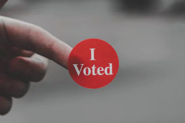 round, red "I voted" sticker