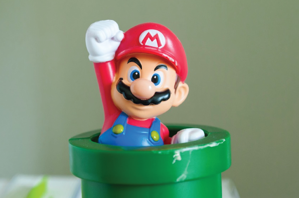 plastic super mario emerging from pipe