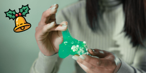 close up of hands manipulating slime with pearls mixed in