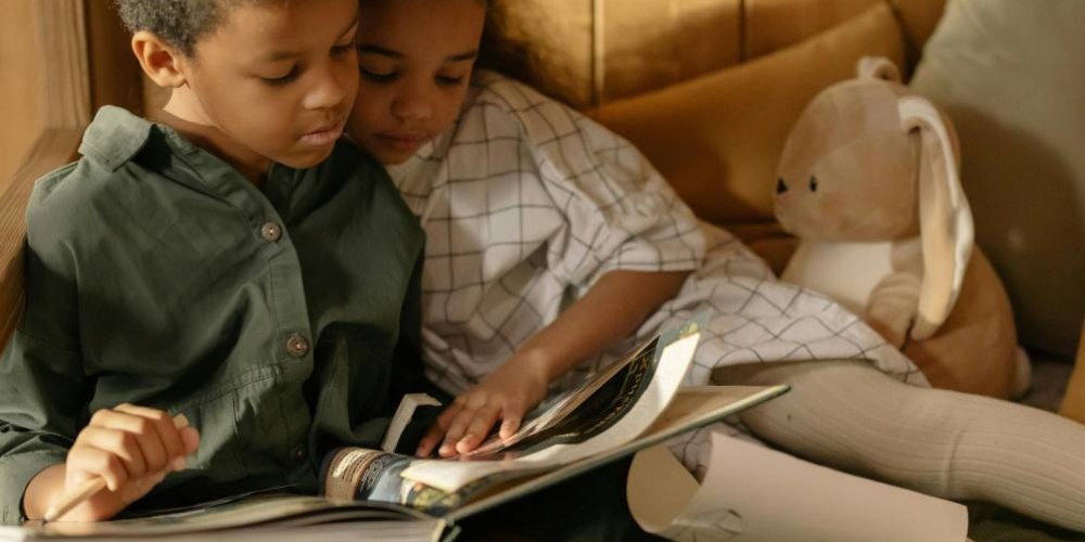 Two kids reading together