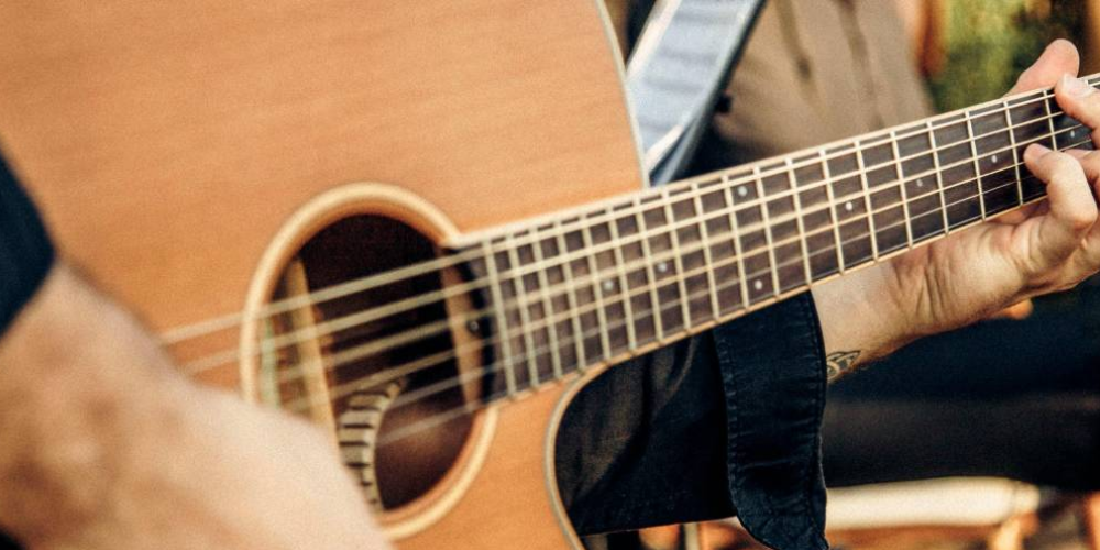 Person playing a guitar