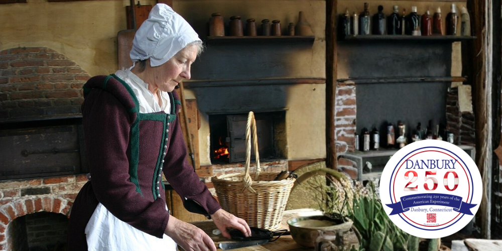Person in colonial dress preparing food