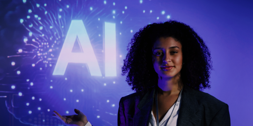 person in suit standing in front of the letters AI